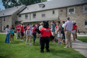 Black Squirrel mascot waving in front of a group on new students and families_Photo by Holden Blanco '17